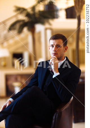 Luxury groom in suit. Businessman. The morning of the groom, bridegroom's fees. Sexy man in suit posing. Luxury groom in suit. Businessman. The morning of the groom, bridegroom's fees. Sexy man in suit posing. 102238752