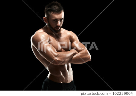 Muscular bodybuilder guy doing posing 102239004