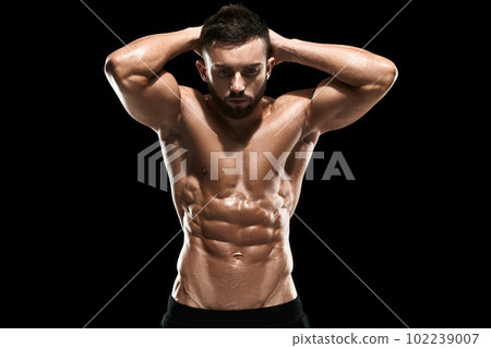 Muscular bodybuilder guy doing posing Muscular bodybuilder guy doing posing 102239007