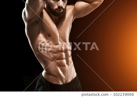 Muscular bodybuilder guy doing posing 102239008
