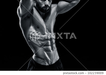 Muscular bodybuilder guy doing posing 102239009