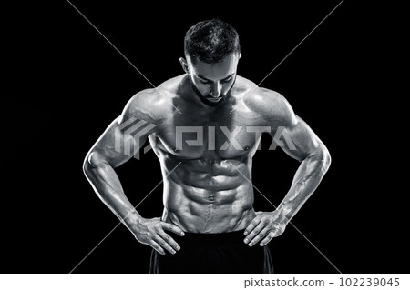 Muscular bodybuilder guy doing posing Muscular bodybuilder guy doing posing 102239045