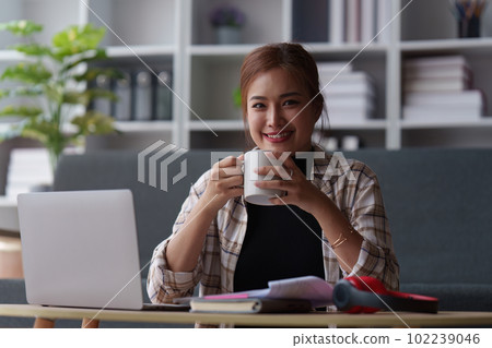 Attractive Asian woman resting comfortable living room and using laptop computer and listen to music, Relax, Sofa, Lifestyle 102239046