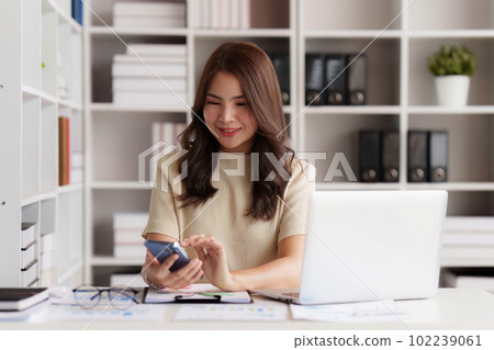 Beautiful Businesswoman completes KYC using an online banking program in order to open a digital savings account. The definition of cyber security 102239061