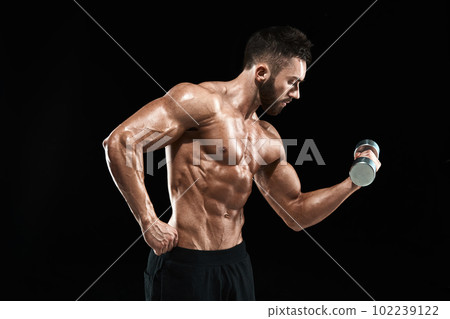 Muscular bodybuilder guy doing posing Muscular bodybuilder guy doing posing 102239122