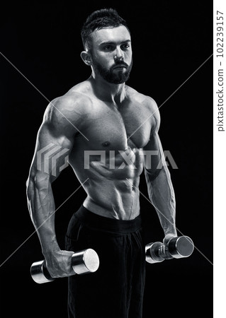 Muscular bodybuilder guy doing posing 102239157