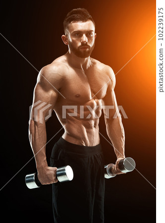 Muscular bodybuilder guy doing posing 102239175