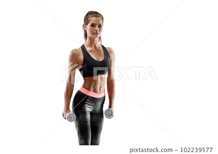Strong woman exercising with dumbbells for arms. Photo of woman working out with dumbbells on white background. Strong woman exercising with dumbbells for arms. Photo of woman working out with dumbbells on white background. 102239577