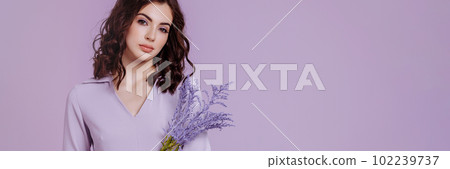 Attractive woman with bouquet on lilac background 102239737