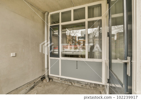 the outside of a building with windows and doors that have been boarded to make it look like an old house the outside of a building with windows and doors that have been boarded to make it look like an old house 102239917