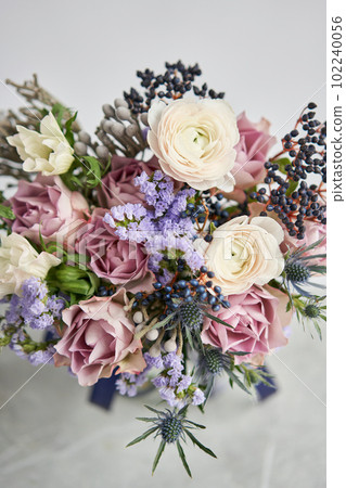 Beautiful bouquet of mixed flowers with ranunculus clooney hanoi in woman hand. Floral shop concept . Beautiful fresh cut bouquet. Flowers delivery Beautiful bouquet of mixed flowers with ranunculus clooney hanoi in woman hand. Floral shop concept . Beautiful fresh cut bouquet. Flowers delivery 102240056