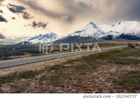 Campo Imperatore - Abruzzo - Italy desolate plain cloudy sky empty roadtrip 102240737