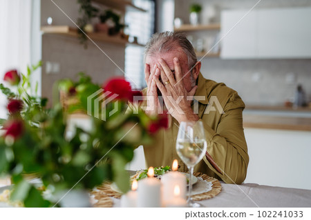 Senior man waiting for her wife for celebrating their anniversary. 102241033