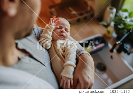 Close-up of father holding his little son. Close-up of father holding his little son. 102241123