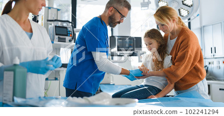 Little girl with her mother in surgery examination. 102241294