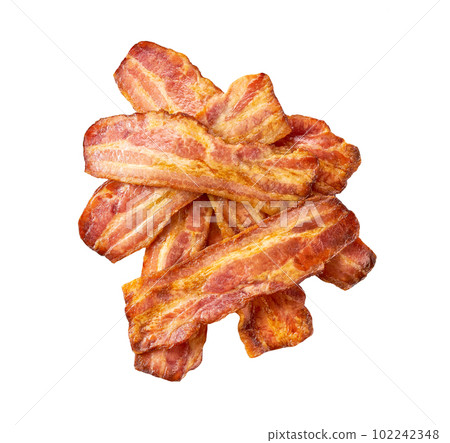 pile of fried bacon strips isolated on white background, top view. 102242348