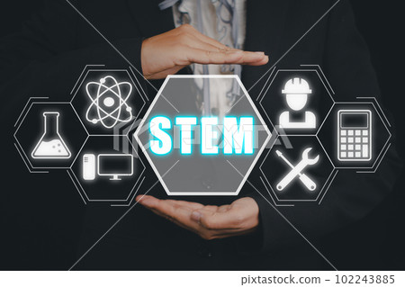 STEM concept, science, technology, engineering, mathematics, Businessman hand holding STEM icon on virtual screen. STEM concept, science, technology, engineering, mathematics, Businessman hand holding STEM icon on virtual screen. 102243885