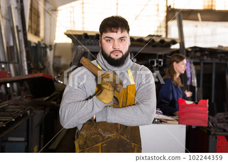 Portrait of confident foreman in workshop 102244359