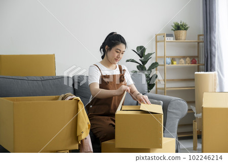 Modern female people in moving home apartment leisure indoor activity alone. 102246214