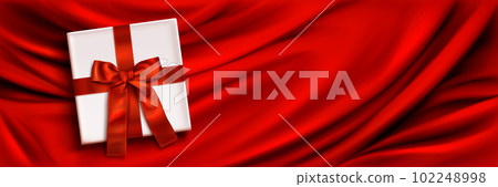Realistic gift box on red silk background Realistic gift box on red silk background 102248998