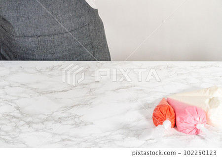 Homemade royal icing in piping bags ready to decorate sugar cookies on the kitchen counter. Homemade royal icing in piping bags ready to decorate sugar cookies on the kitchen counter. 102250123