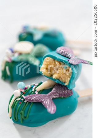Sliced cakesicles with a chocolate mermaid tail. 102250506
