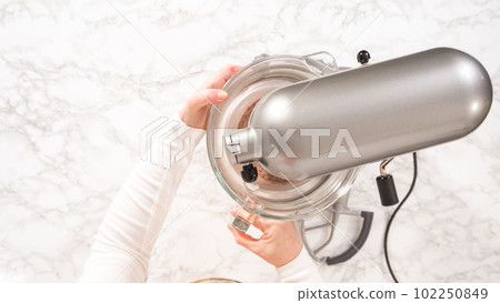 Flat lay. Step by step. Whipping chocolate ganache with an electric kitchen mixer. Flat lay. Step by step. Whipping chocolate ganache with an electric kitchen mixer. 102250849