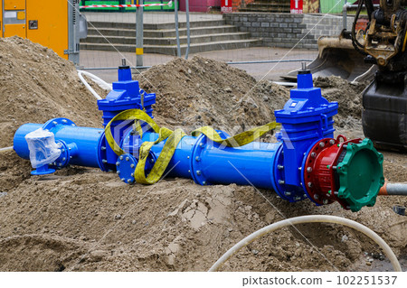 New 300mm city main drink water pipeline with gate valves before connecting to underground system 102251537