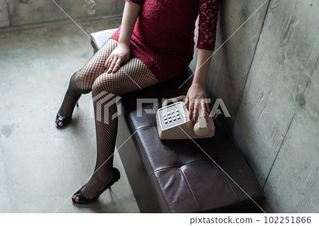 A woman putting a hand on the receiver A woman putting a hand on the receiver 102251866