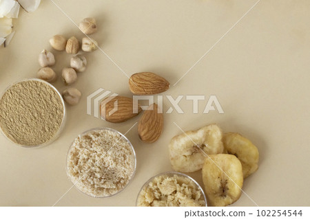 Three kinds of gluten-free flour on a beige background. Chickpea, almond and banana. Useful Foods 102254544