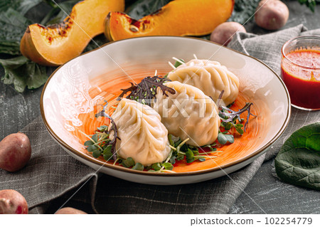 Portion of manti dumplings stuffed with pumpkin 102254779