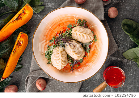 Portion of manti dumplings stuffed with pumpkin Portion of manti dumplings stuffed with pumpkin 102254780