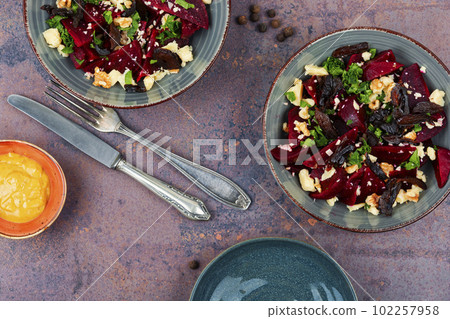 Beetroot salad with wallnuts and cheese. 102257958