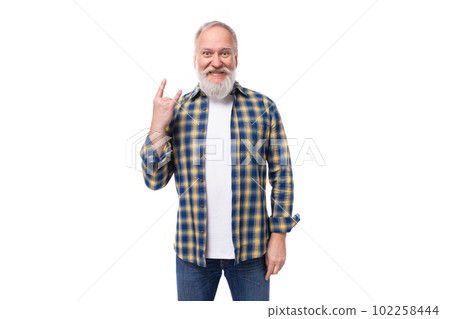 senor gray-haired retired man with a mustache and beard pointing to the side with his index finger 102258444