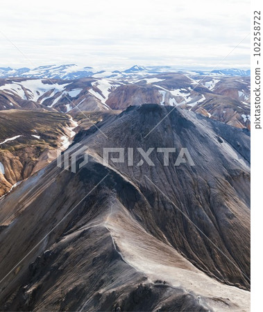 Drone Aerial of Landmannalaugar Mountain Range in Iceland. High quality photo. Famous rhyolite mountains in central Icelandic highlands. Drone Aerial of Landmannalaugar Mountain Range in Iceland. High quality photo. Famous rhyolite mountains in central Icelandic highlands. 102258722