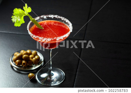Bloody Mary cocktail with celery and green olives. Bloody Mary cocktail with celery and green olives. 102258783