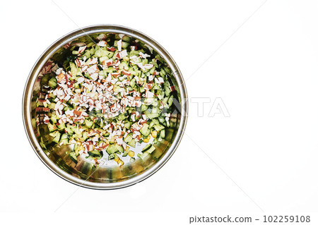 Metal saucepan with chopped vegetables, salad ingredients isolated on white Metal saucepan with chopped vegetables, salad ingredients isolated on white 102259108