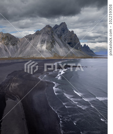 Vestrahorn Black Sand Beach in Stokksnes, Iceland. High quality photo. The horned mountains of east Iceland Aerial Drone image 102259308
