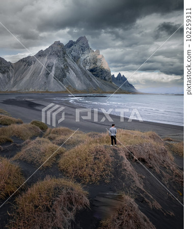 Vestrahorn Black Sand Beach in Stokksnes, Iceland. High quality photo. The horned mountains of east Iceland Aerial Drone image Vestrahorn Black Sand Beach in Stokksnes, Iceland. High quality photo. The horned mountains of east Iceland Aerial Drone image 102259311