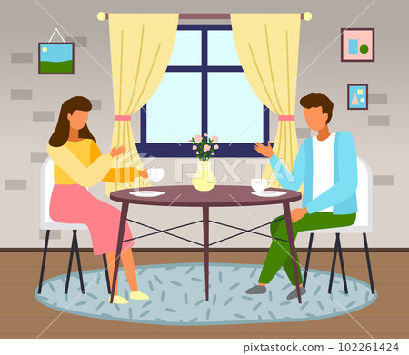 Man and woman sitting at the table with coffee in home interior. Married couple drink tea in kitchen Man and woman sitting at the table with coffee in home interior. Married couple drink tea in kitchen 102261424