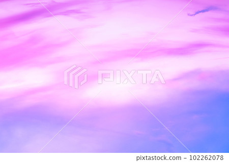 Twilight sky with effect of light in pastel pink, coral, orange, blue tones. Colorful sunset of soft clouds. Background 102262078