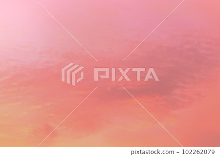 Twilight sky with effect of light in pastel pink, coral, orange, blue tones. Colorful sunset of soft clouds. Background 102262079