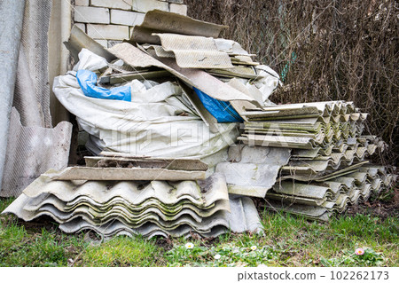 Roofing slate in a pile. Asbestos, harmful to humans and the environment Roofing slate in a pile. Asbestos, harmful to humans and the environment 102262173