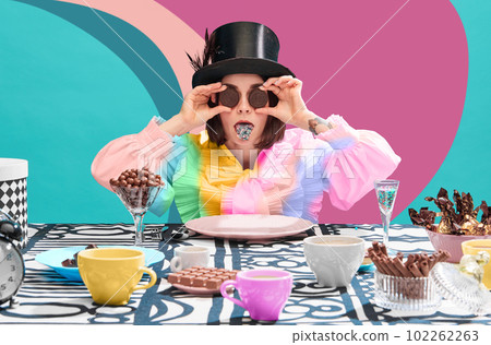 Funny image of woman, sweets lover holding chocolate cookies on eyes, sticking tongue with sparkles over bastract multicolored background 102262263