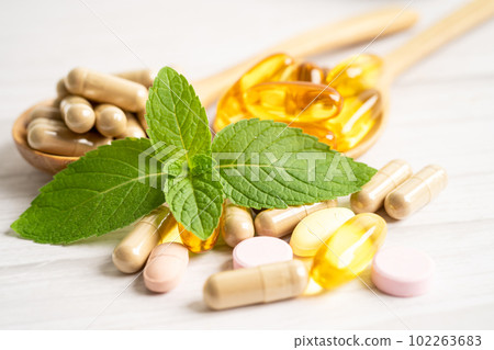 Alternative medicine herbal organic capsule with vitamin E omega 3 fish oil, mineral, drug with herbs leaf natural supplements for healthy good life. Alternative medicine herbal organic capsule with vitamin E omega 3 fish oil, mineral, drug with herbs leaf natural supplements for healthy good life. 102263683