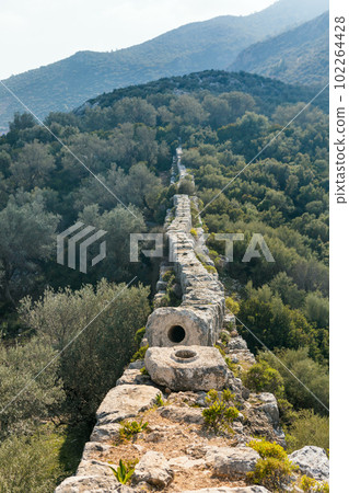 Ruins of old Roman Delikkemer aqueduct bridge at Lycian way Ruins of old Roman Delikkemer aqueduct bridge at Lycian way 102264428