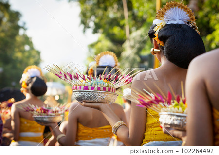 Procession of beautiful Balinese women in traditional costumes Procession of beautiful Balinese women in traditional costumes 102264492