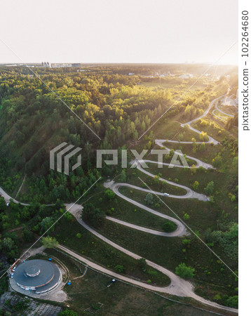 Aerial top vew of winding road in the city Aerial top vew of winding road in the city 102264680