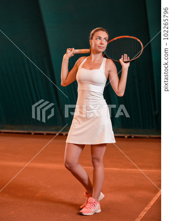young sportswoman playing tennis young sportswoman playing tennis 102265796
