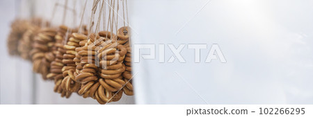 A bundle of dry ring-shaped cookies. Russian traditional cookies. A bundle of dry ring-shaped cookies. Russian traditional cookies. 102266295